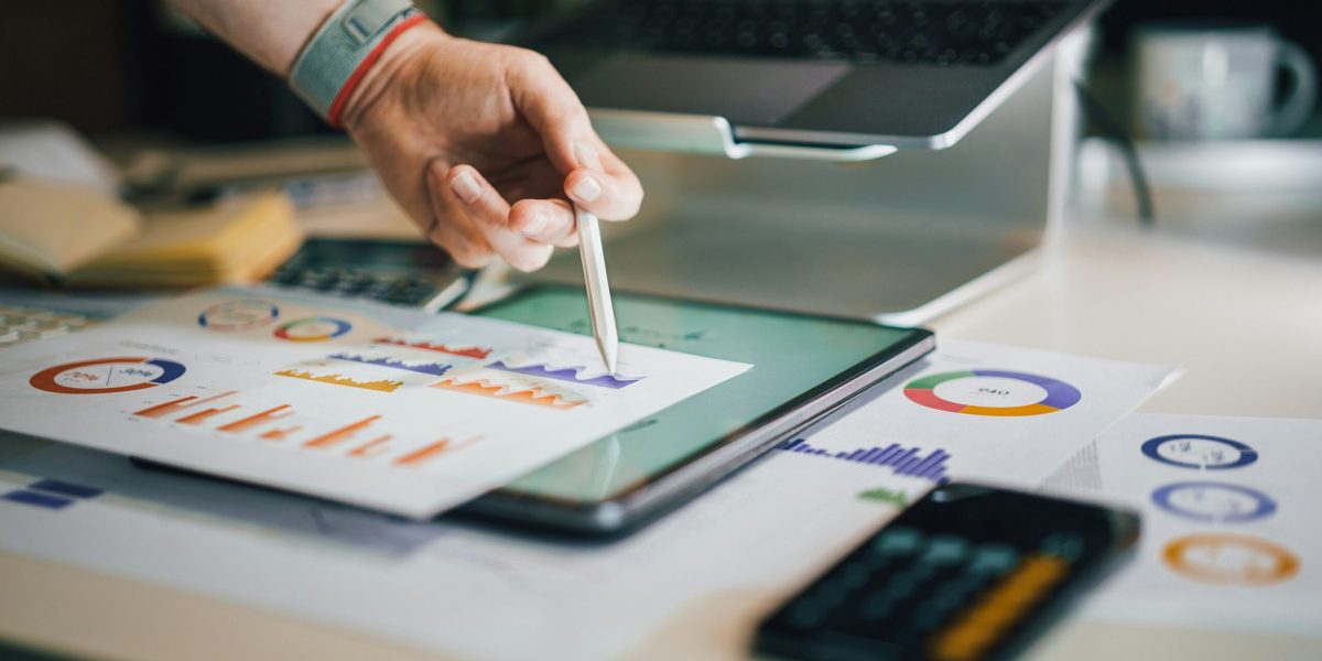 a person is writing on a piece of paper - IT Downtime 