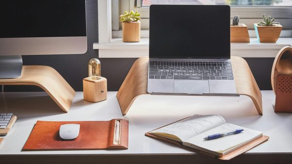 Device organization Free A stylish and contemporary home office setup with laptop and desk accessories. Stock Photo