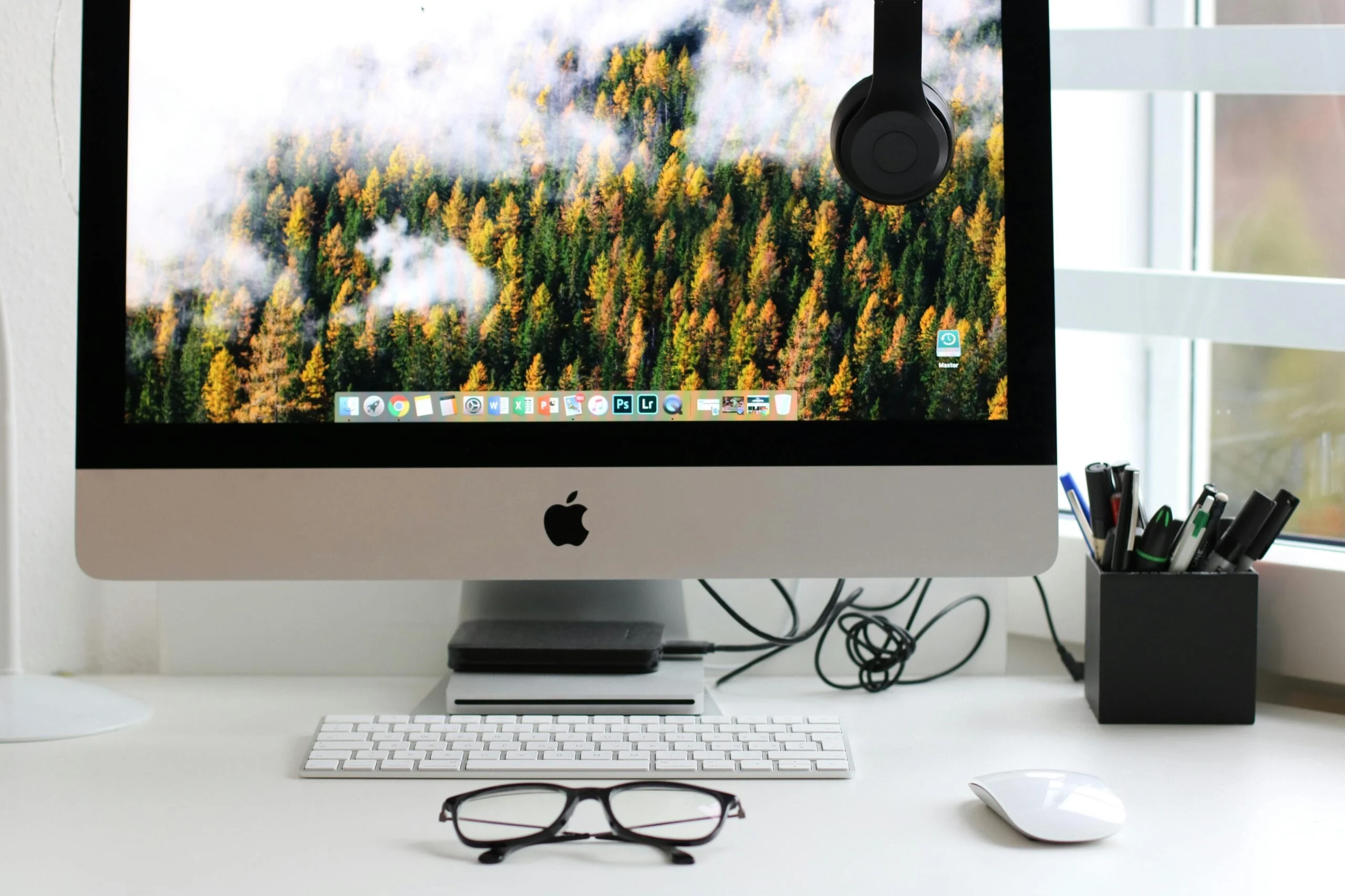 desktop customization Free Stylish home office workspace featuring a computer setup with accessories. Stock Photo