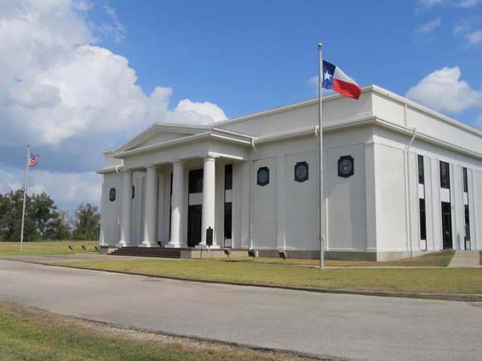 White building with Texas flag