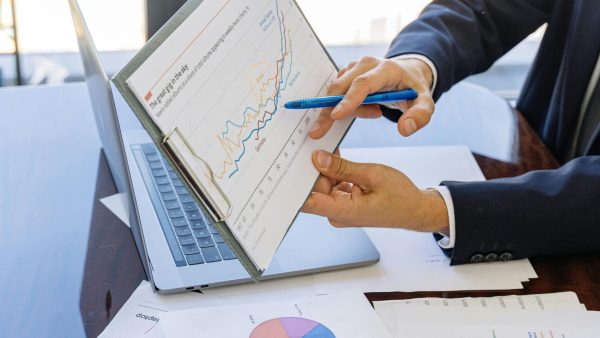 data quality Free Business professionals discussing financial graphs and charts in an office setting. Stock Photo