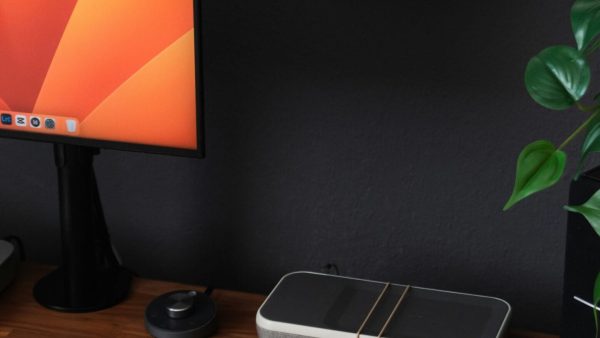 Microsoft Planner a desk with a laptop, keyboard, mouse and a monitor