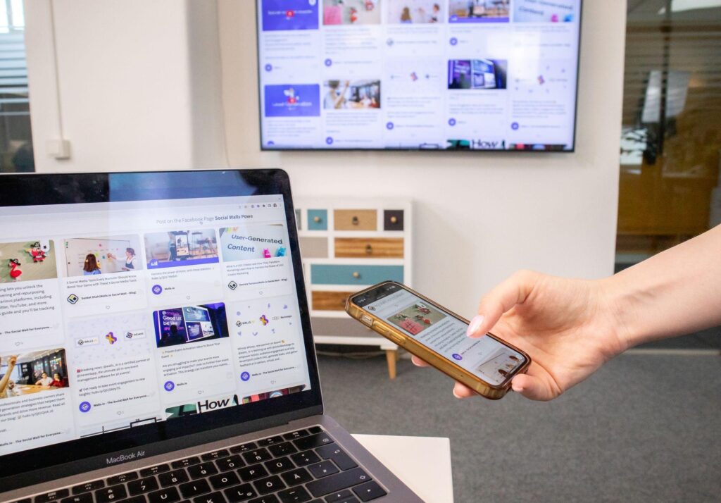 Phones, a tablet, and a laptop on an office desk
