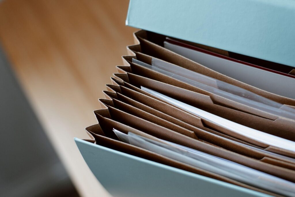 Open folder of business records on a desk